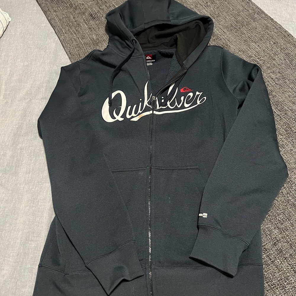 For sale is a used Quicksilver zip up hoodie Size M.